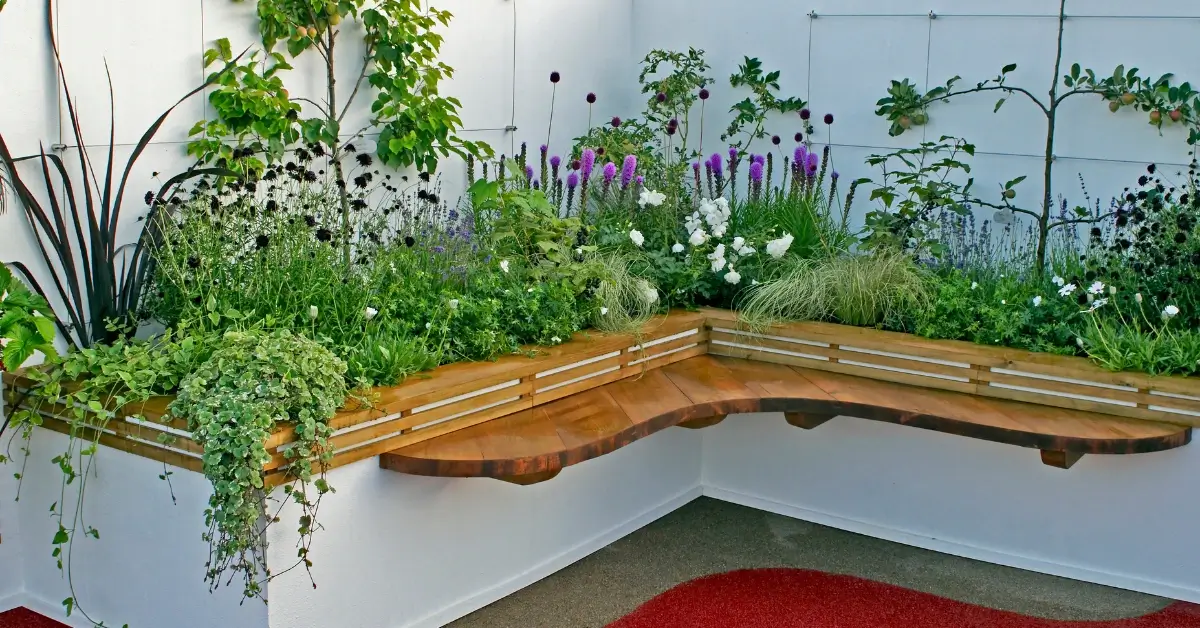 A beautiful garden corner ideas with wooden seating
